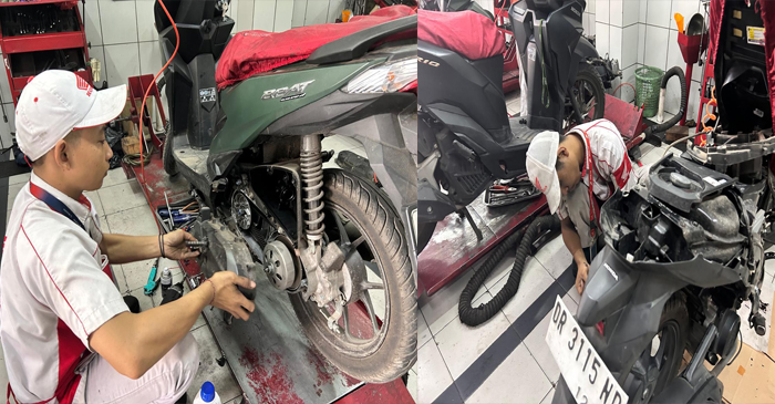 Terlihat sepeda motor Honda saat diservice oleh petugas.